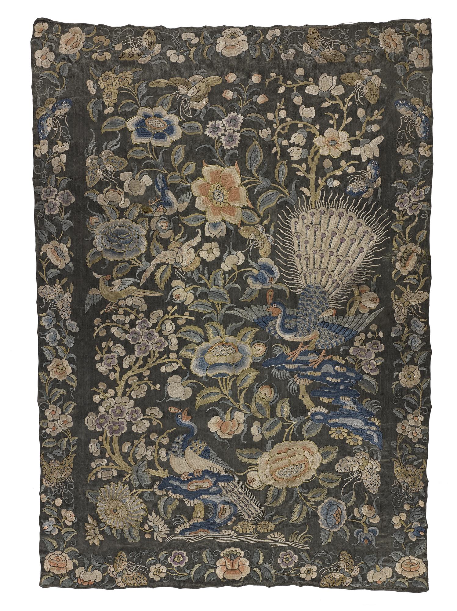 Sage green satin panel embroidered in coloured silks and showing a design of peacocks, birds and flowering plants surrounded by a floral border: China, possibly early 19th century.