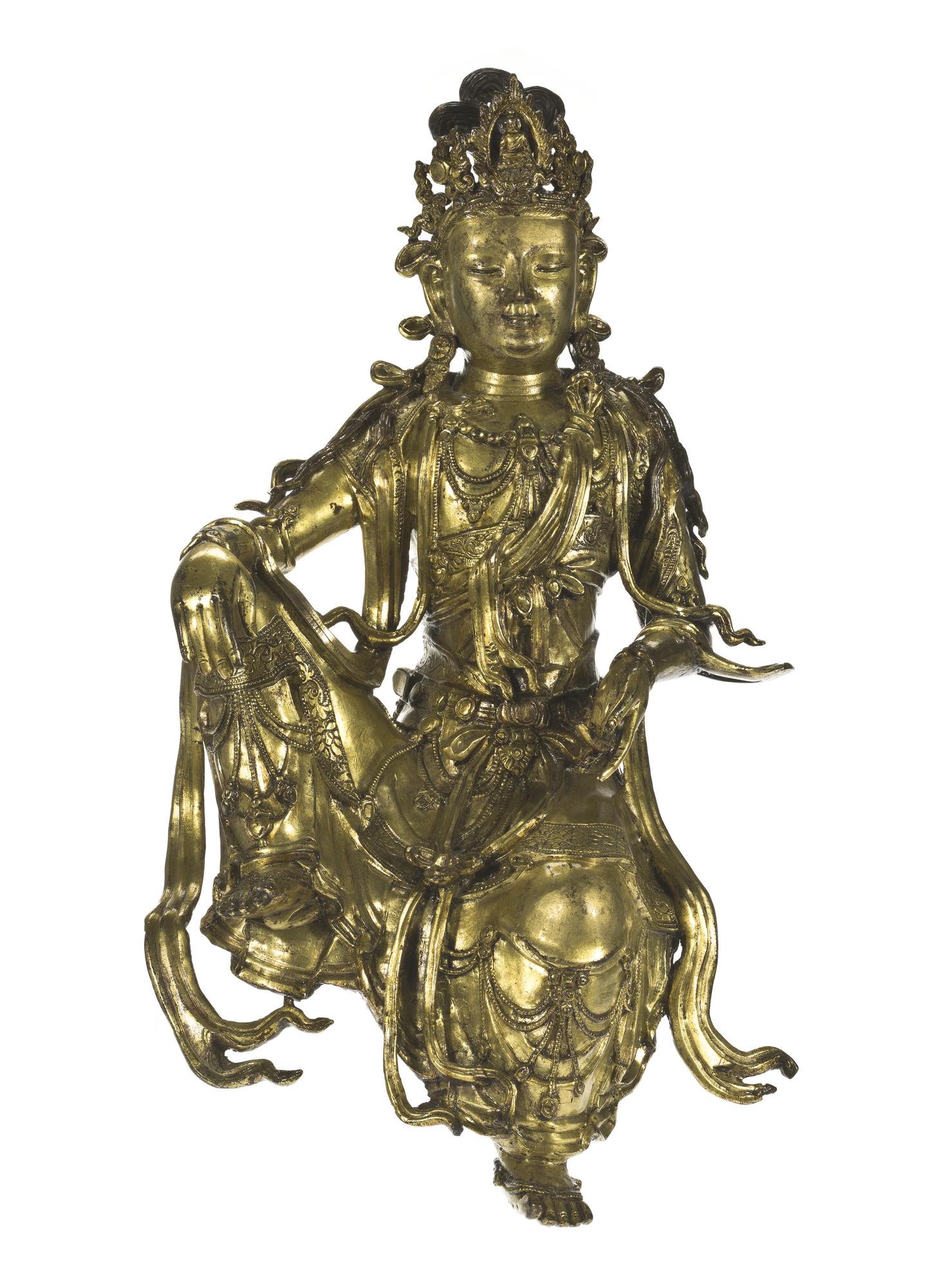 Figure of Guanyin, bodhisattva of compassion, in gilt bronze, with flowing robes, a jewelled corsage and diadem: China, Qing Dynasty, Qianlong reign, 1736-95 AD.