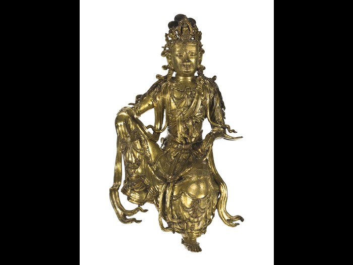 Figure of Guanyin, bodhisattva of compassion, in gilt bronze, with flowing robes, a jewelled corsage and diadem: China, Qing Dynasty, Qianlong reign, 1736-95 AD.