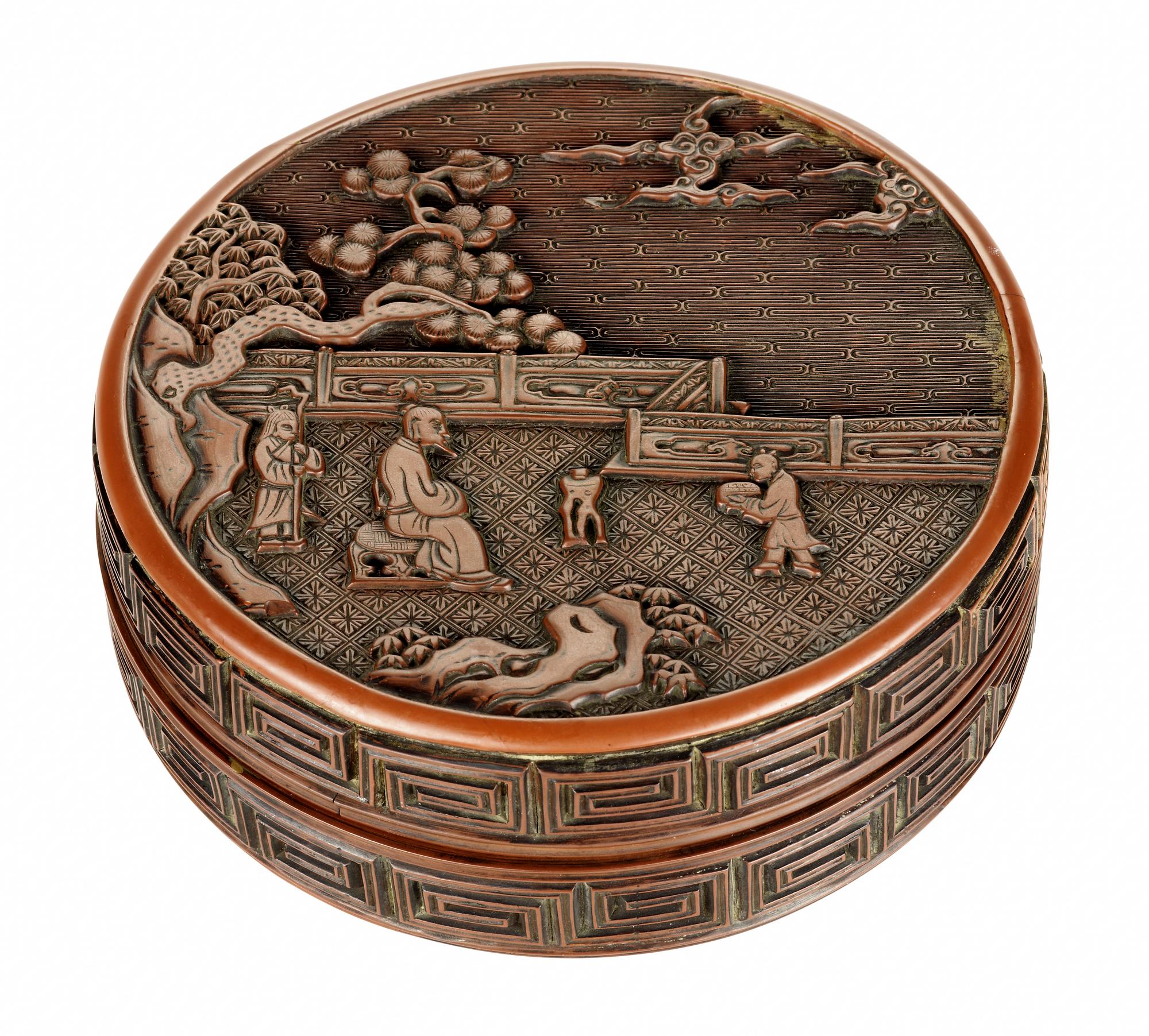 Box of red lacquered wood, small circular, decorated with a sage seated in a garden flanked by two attendants, with thunder pattern on the side: China, Yuan dynasty, by Zhang Cheng, 1279-1368.