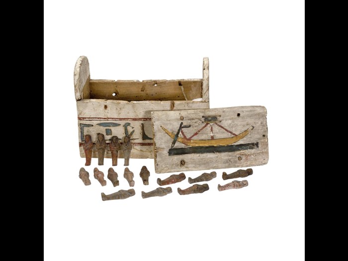 One of sixteen pottery mould-made shabtis contained in a rectangular shabti box made of wood: Ancient Egyptian, Late Period.
