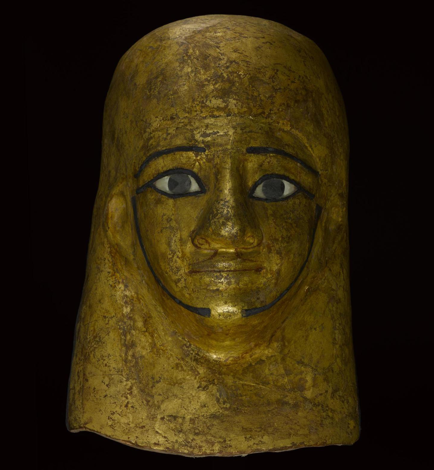Mummy-mask of gilded and painted linen and plaster cartonnage, depicting Montsuef wearing a lappet-wig: Ancient Egyptian, c.9BC