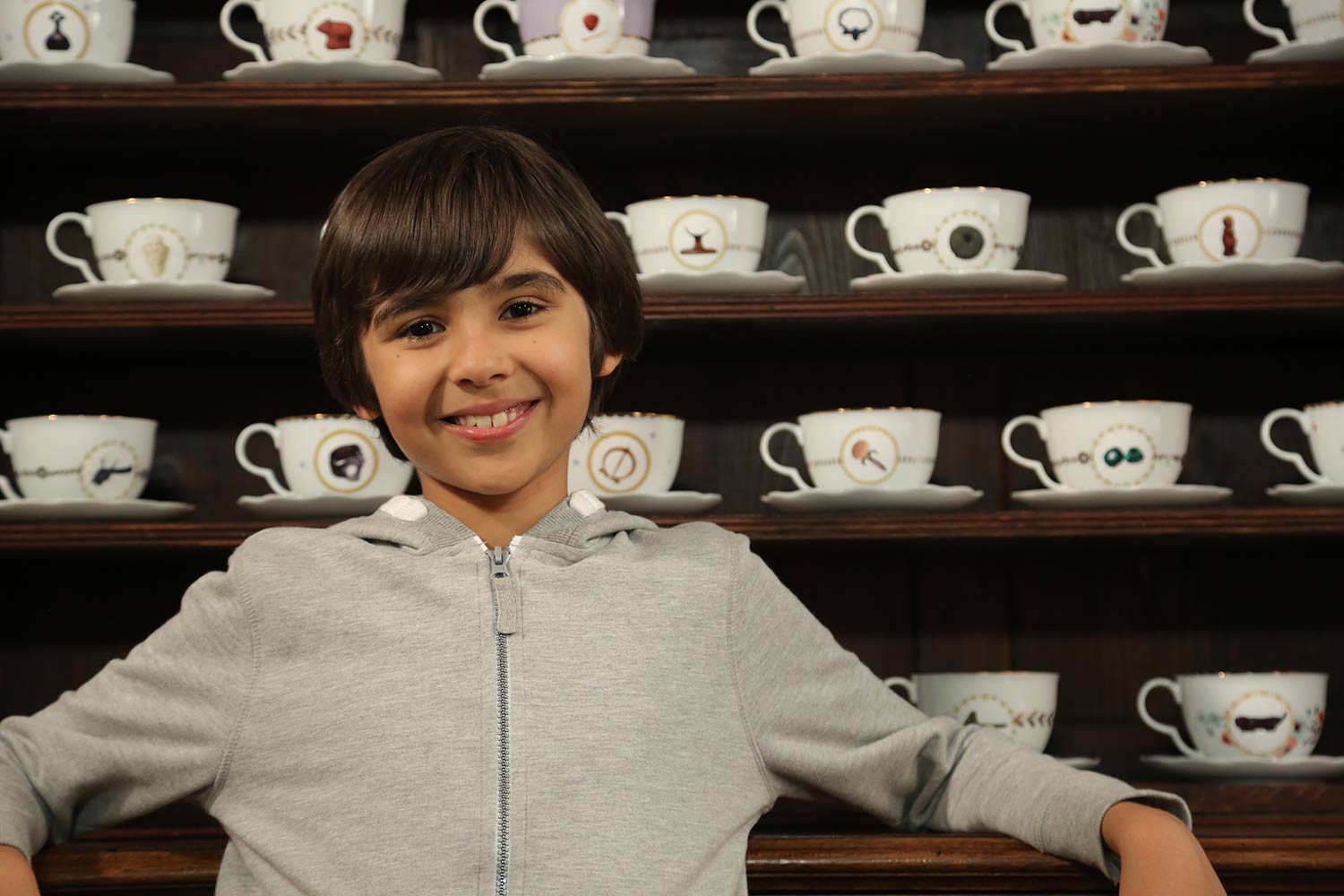 Lokesh-in-front-of-the-teacup-cup-cabinet.jpg