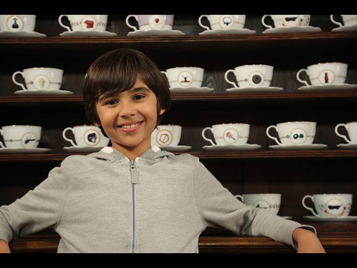 Lokesh-in-front-of-the-teacup-cup-cabinet.jpg