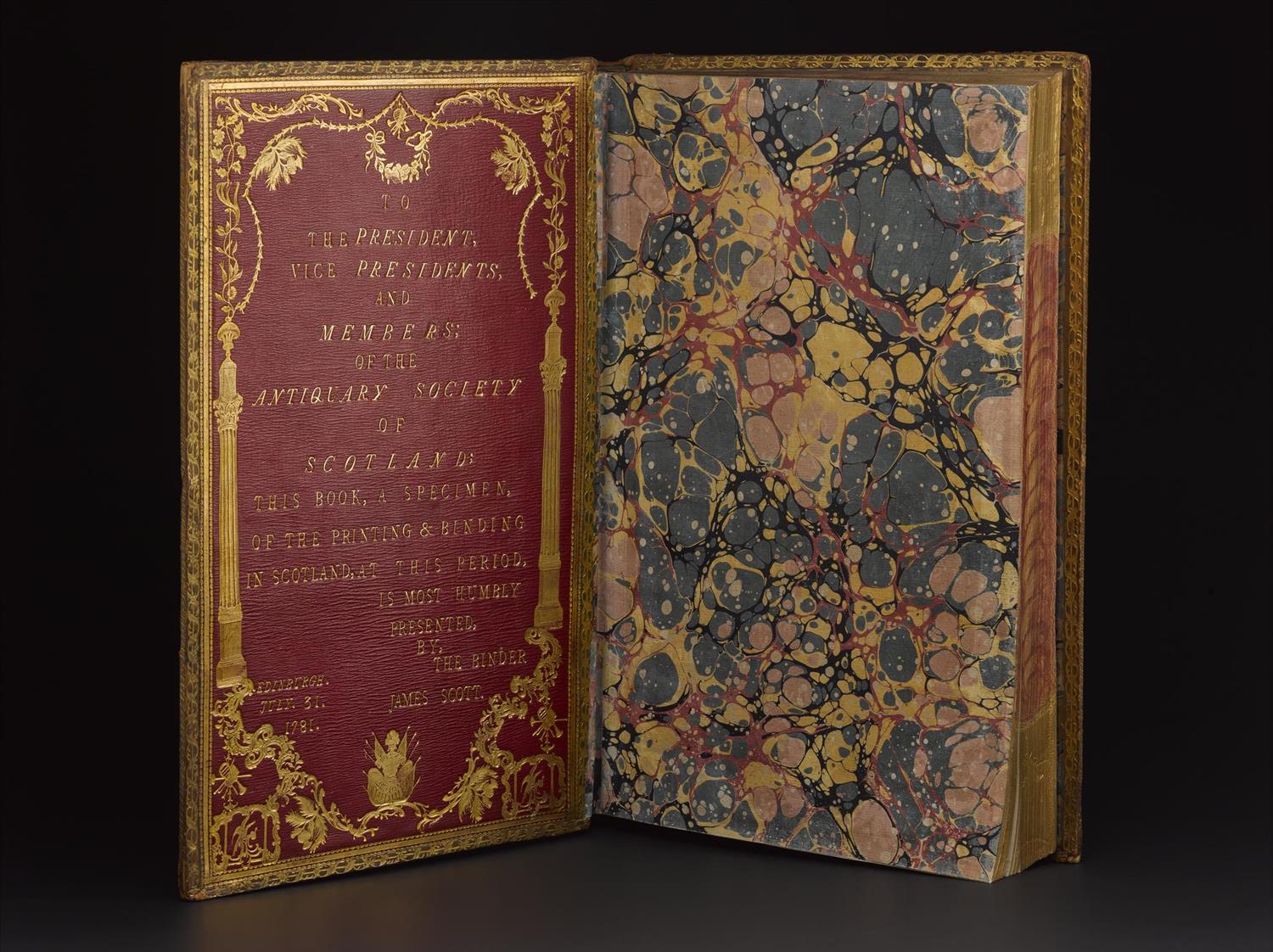 Front board with tooled inscription and marbled end paper of Paradise Lost by John Milton, bound by James Scott, 1781.