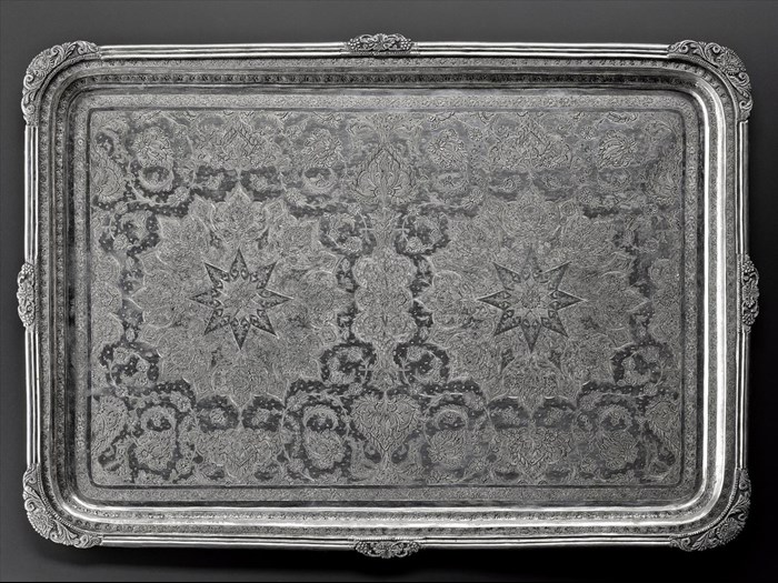 Rectangular tray of silver with a symmetrical pattern of two star shapes surrounded by stylized floral motifs and animals, hallmarked on the front, Iran, probably Isfahan, 1920s-1940s, acc. no V.2015.63
