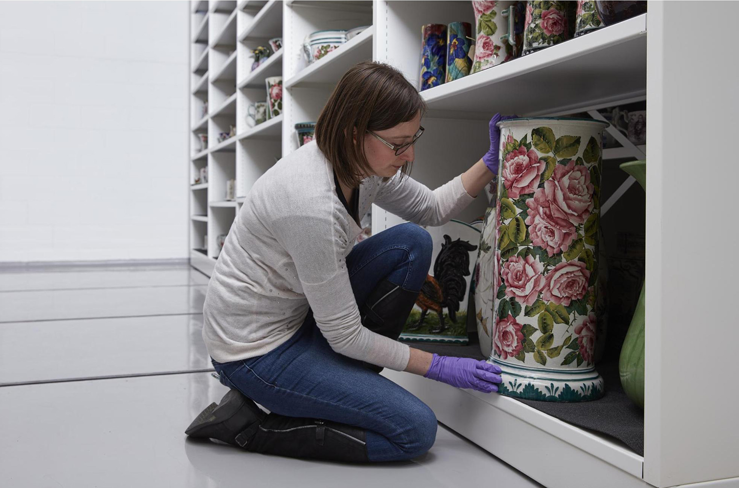 Adrienne, Assistant Curator of Scottish History and Archaeology selects Umbrella Stand from storage in the National Museums Collection Centre. The Cabbage roses on this late 19th century piece are one of the most recognisable Wemyss Ware designs. 