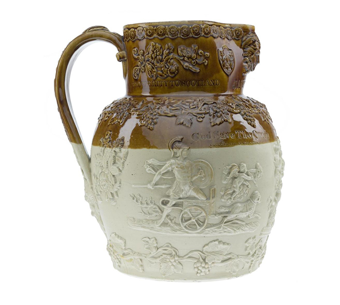 This jug probably made by Newbigging Pottery in Musselburgh is a rare example of elaborately decorated brown stoneware, a material normally used for jars and bottles. 