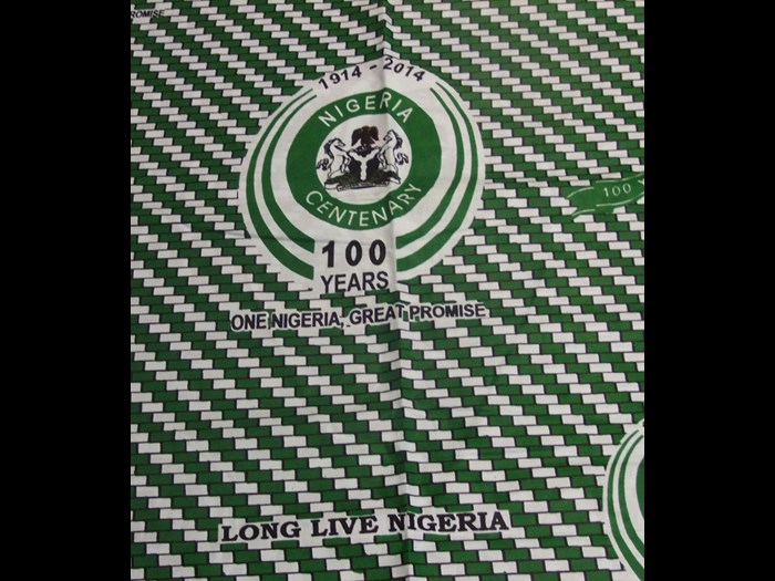 Cotton cloth printed to commemorate 'Nigeria100', marking the centenary of the merger between Northern and Southern Nigeria: Africa, West Africa, Nigeria, 2014.