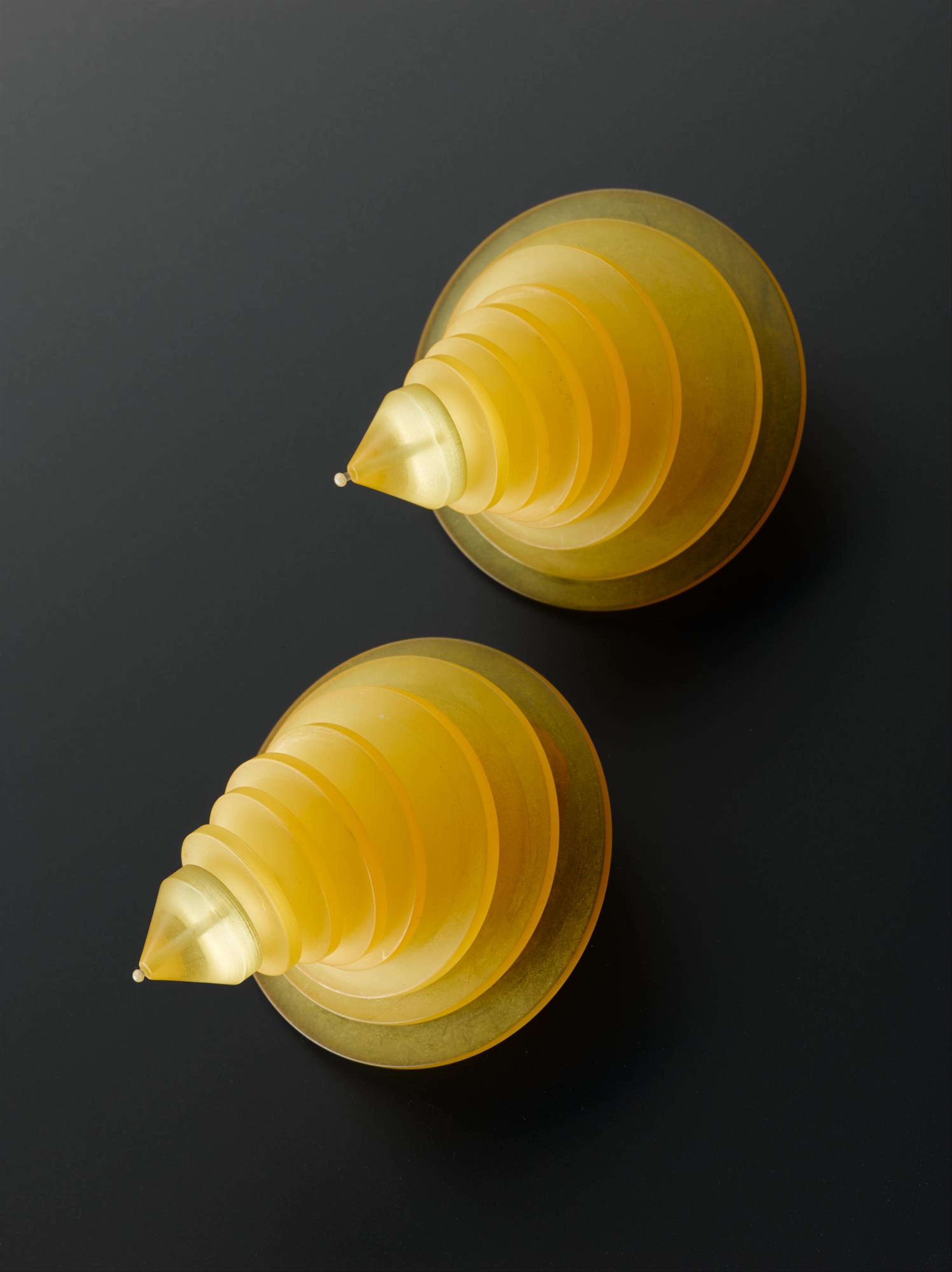 Clip-on earrings of translucent yellow acrylic: British, designed for Jean Muir by C & N Buttons & Jewellery Production, 1980s.