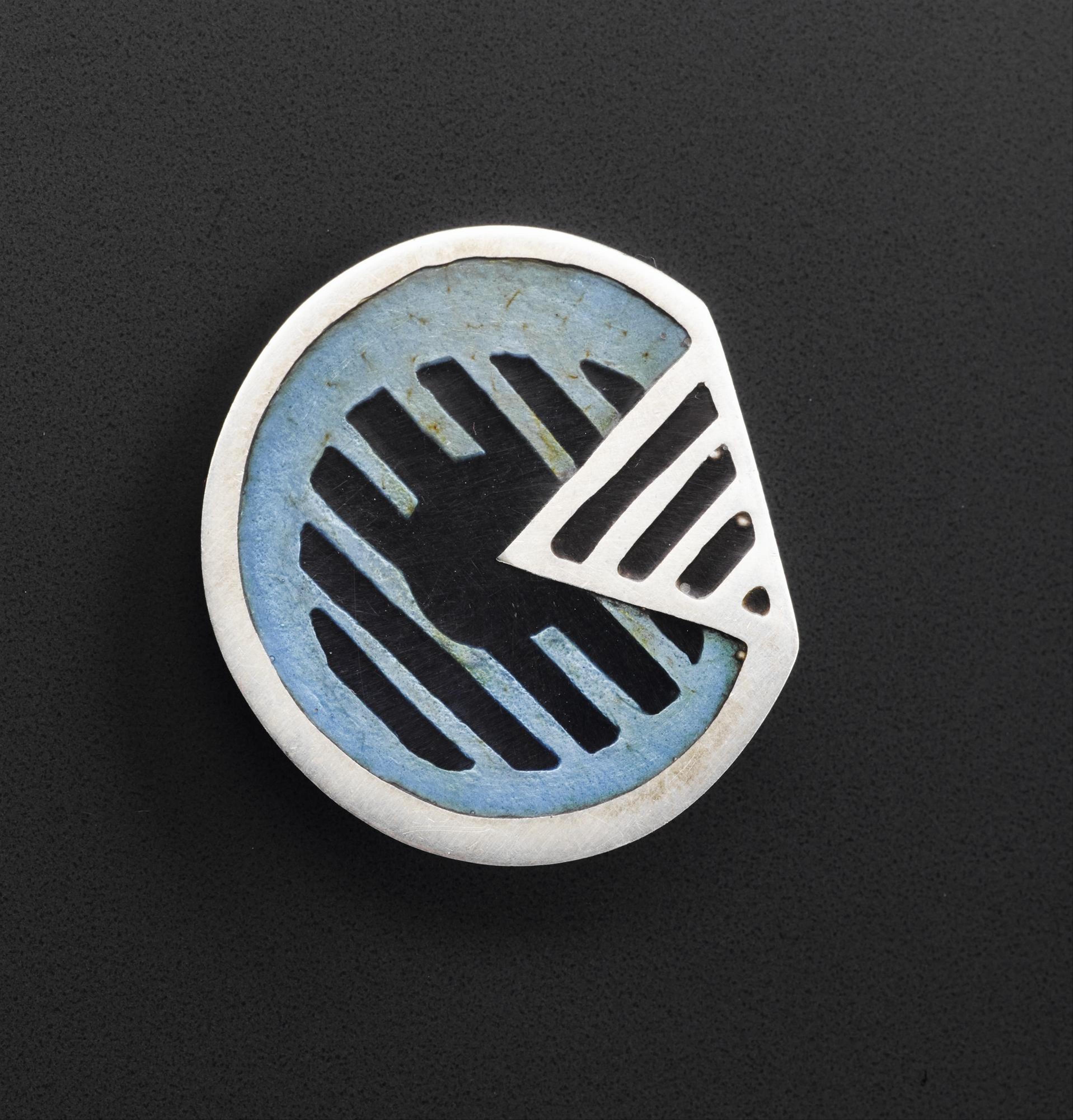 Button of silver, with enamel inlay: British, by Iain Young for Jean Muir Ltd, 1966-95.