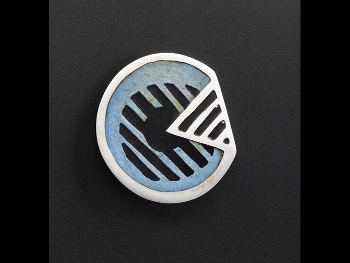 Button of silver, with enamel inlay: British, by Iain Young for Jean Muir Ltd, 1966-95.
