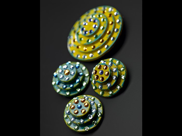 Brooches representing sea barnacles, of wood and plastic beads: British, by Annie Sherburne for Jean Muir Ltd, Australian Bicentennial Collection, 1988.