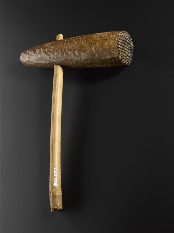 Barkcloth beater with cross-hatched wooden head and cane/wooden haft: Africa, East Africa, Uganda or Kenya, Lake Victoria, early 20th century.