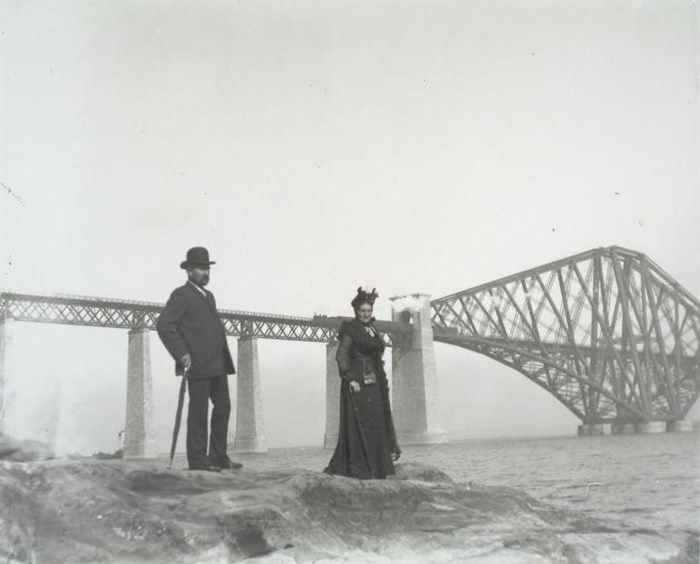 Couple posing in front of the Forth Bridge, 1905