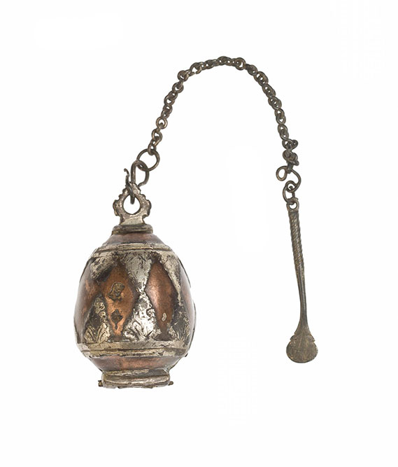 Lime box of copper in hinged halves, with chased silver triangle inlay and silver mounts, and a silver spatula attached by a silver chain, for holding lime used in betel chewing: Asia, South Asia, Sri Lanka, Sinhalese, 19th century.