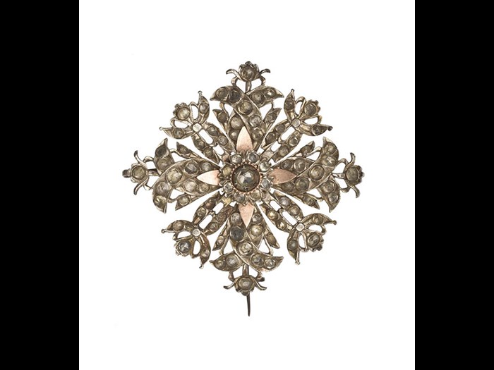 Brooch of white metal, square, with an ornamental openwork design, and set with white stones: South Asia, Sri Lanka, 19th century.