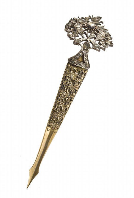 Hairpin of white metal and brass, with a head of an openwork foliaceous design set with white stones: South Asia, Sri Lanka, 19th century.