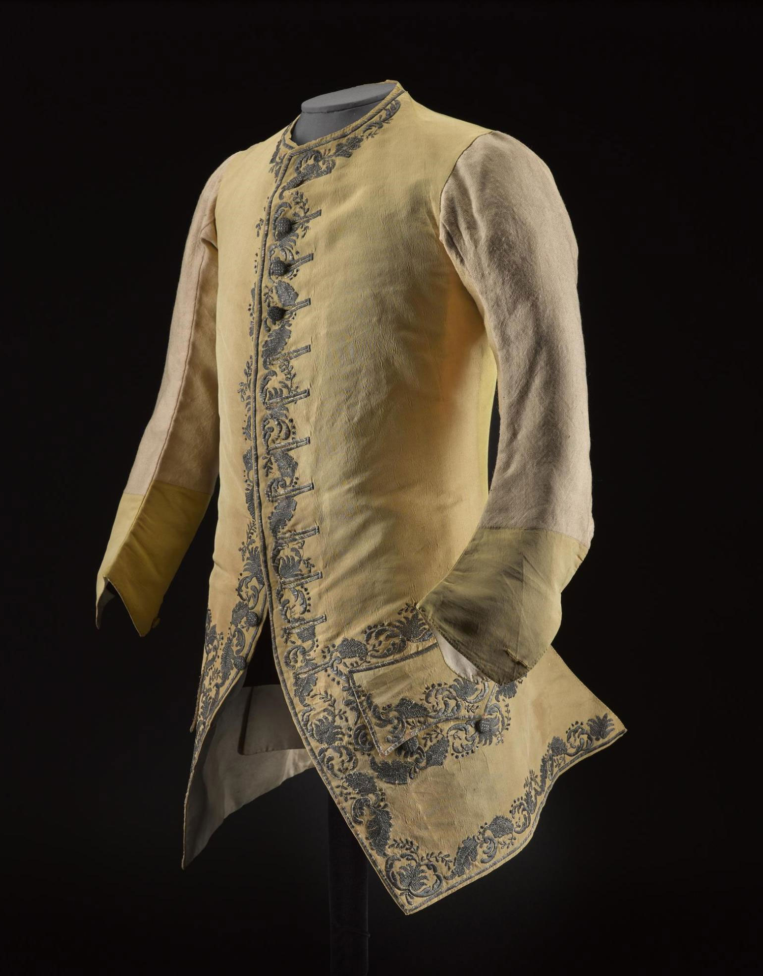 Man's sleeved waistcoat of yellow silk rep, embroidered with a floral design in silver thread, said to have belonged to Prince Charles Edward Stuart.