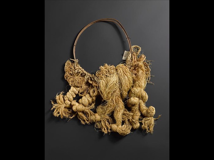 Five samples of undyed palm raffia thread twisted into skeins attached to a carrying ring of split bamboo cane, probably for use by raffia producers to merchandise their thread to weavers: Africa, Central Africa, Democratic Republic of the Congo, early 20th century.