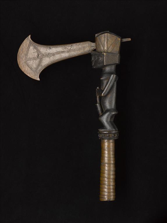 Axe with copper celt blade driven through head of wooden handle carved in form of a woman pounding grain, grip bound with copper ribbon: Africa, Central Africa, Democratic Republic of the Congo, Katanga, late 19th century.