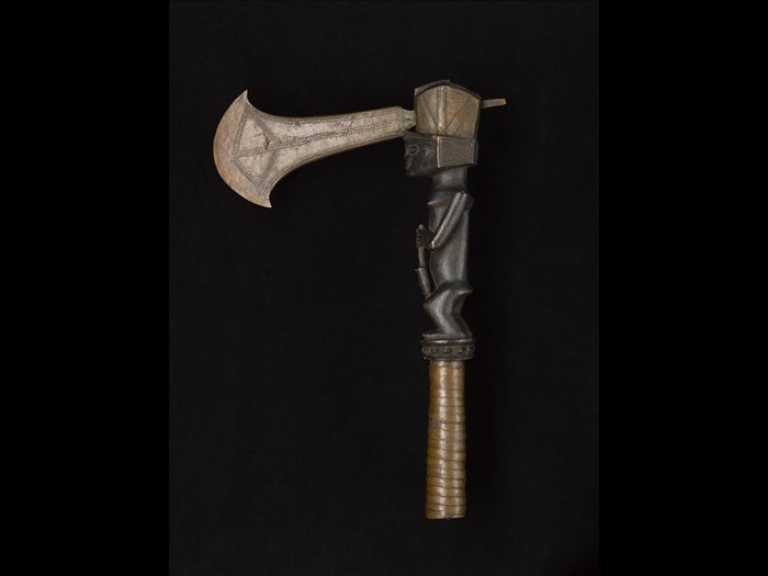 Axe with copper celt blade driven through head of wooden handle carved in form of a woman pounding grain, grip bound with copper ribbon: Africa, Central Africa, Democratic Republic of the Congo, Katanga, late 19th century.