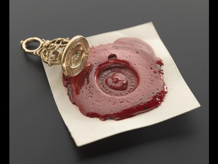 Oval gold fob seal with the head of James Francis Edward, and an impression in red wax. 