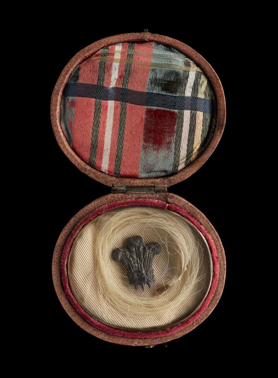 Locks of hair were a commonly found on such ‘relics’ purporting to be from the prince. This small locket contains hair alleged to have been that of Prince Charles Edward Stuart, with Prince of Wales feathers in the centre.