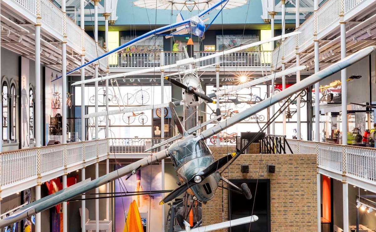 3 different airplanes hang from the ceiling in the three-story science and technology galleries.