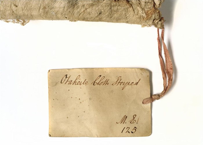 An old label attached to barkcloth A.UC.44 showing the original number in the University Collection2