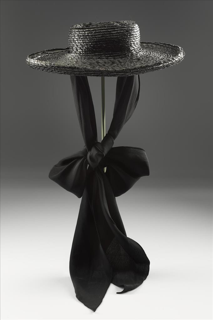Woman's black straw hat designed by Elsa Schiaparelli, late 1930s. You can see this hat in the Fashion and Style gallery at the National Museum of Scotland.