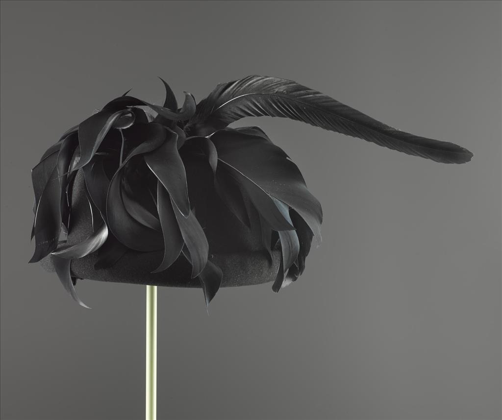 Woman's black felt hat with cockerel feathers designed by Elsa Schiaparelli, late 1930s. You can see this hat in the Fashion and Style gallery at the National Museum of Scotland.
