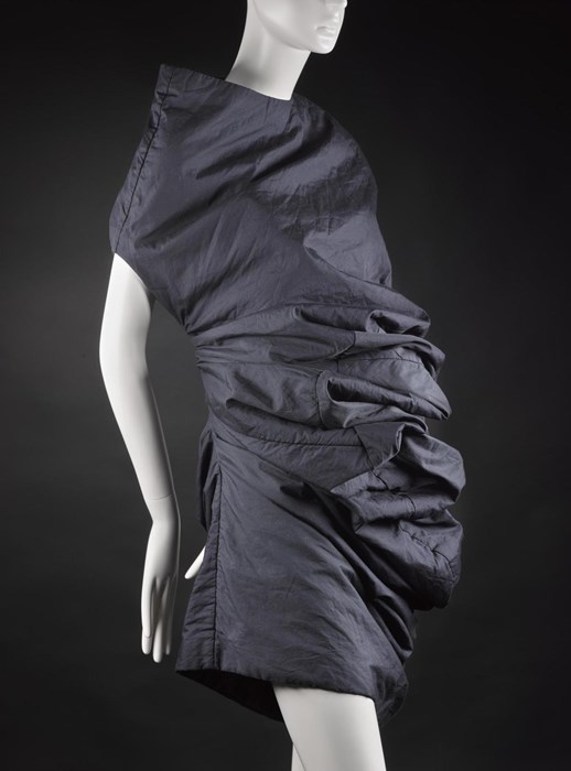 Dress from 'Body Meets Dress' or 'Bump' collection, of blue/black polyester and cotton, padded with tulle, designed by Rei Kawakubo for Comme des Garçons, Spring/Summer 1997.