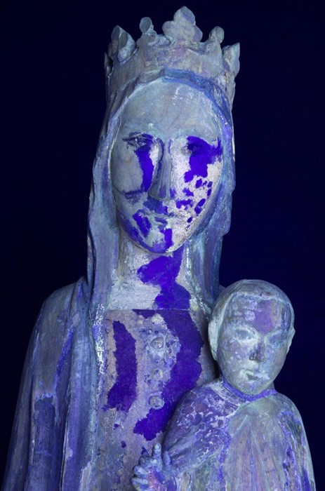 The Madonna under UV light, which reveals large areas of overpainting. The very dark purple-blue areas were carried out at the museum in the 1960s.