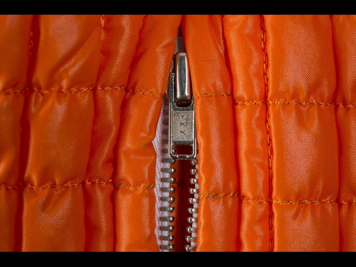 Detail of orange jacket belonging to Shirley Manson.