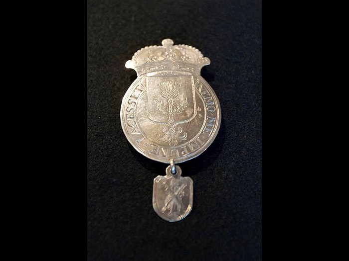 Badge of the Conservator of the Scottish Privileges in the Netherlands, silver, ca. 1750. The badge was the insignia of the Conservator of the Scottish Privileges in the Netherlands who had his residence in the Scots House in Veere. (Zeeuws Archief, Veere 2007.07.01 / Scots House Veere, on loan from John Dermot Turing)
