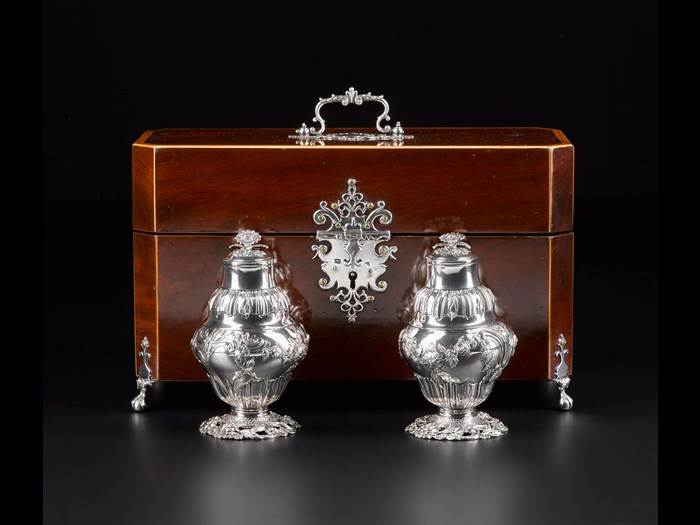 Rectangular mahogany box with silver mounts, used to contain a silver sugar bowl and pair of tea bottles: English, London, by M.I., 1762. National Museums Scotland, A.1979.502 F.