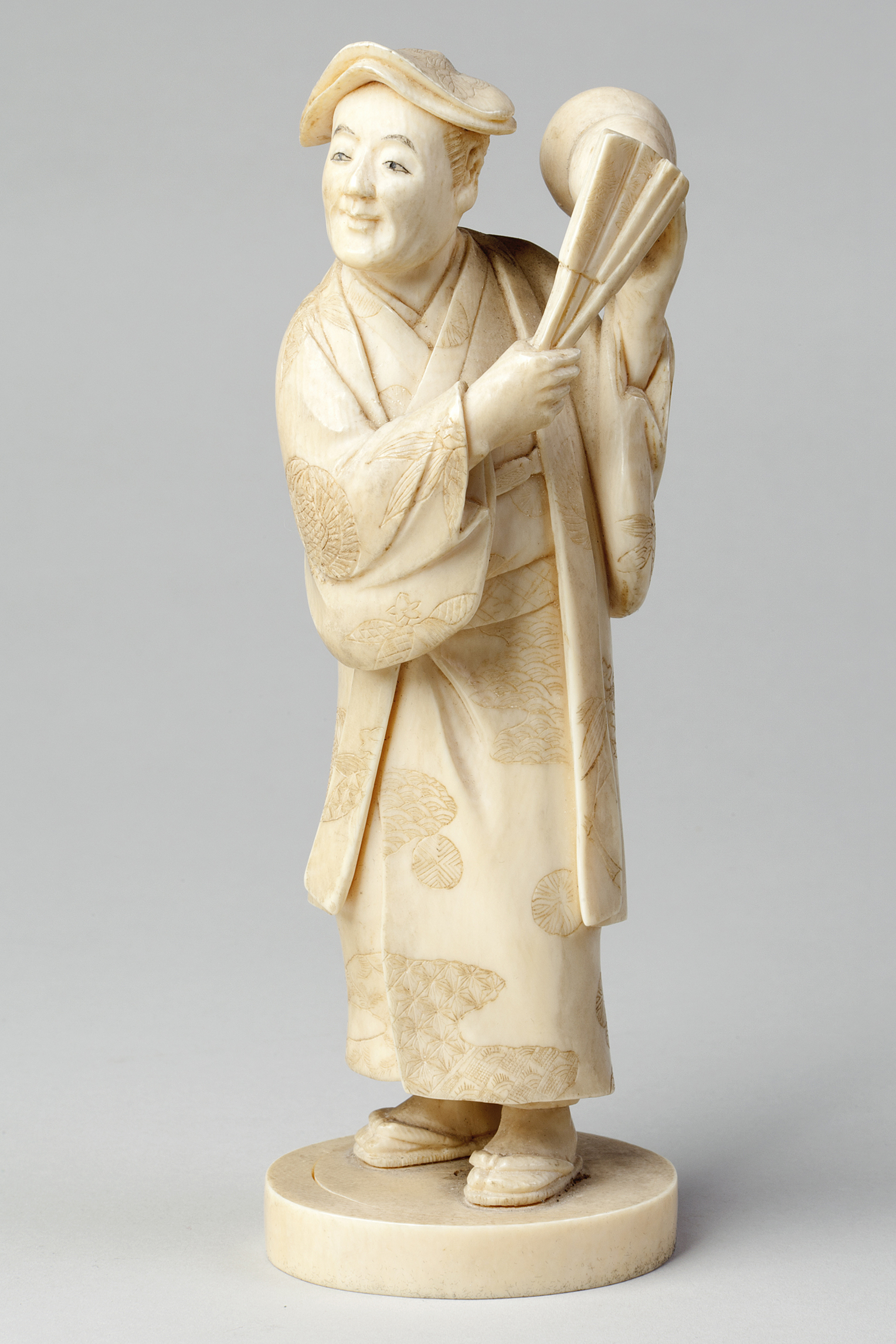 Japanese Carved Okimono Figure of a Man with a Fan. Meiji Period, 1868-1912. Presented in 1968 by Miss V Thomson. © Aberdeen City Council (Art Gallery and Museums Collections)