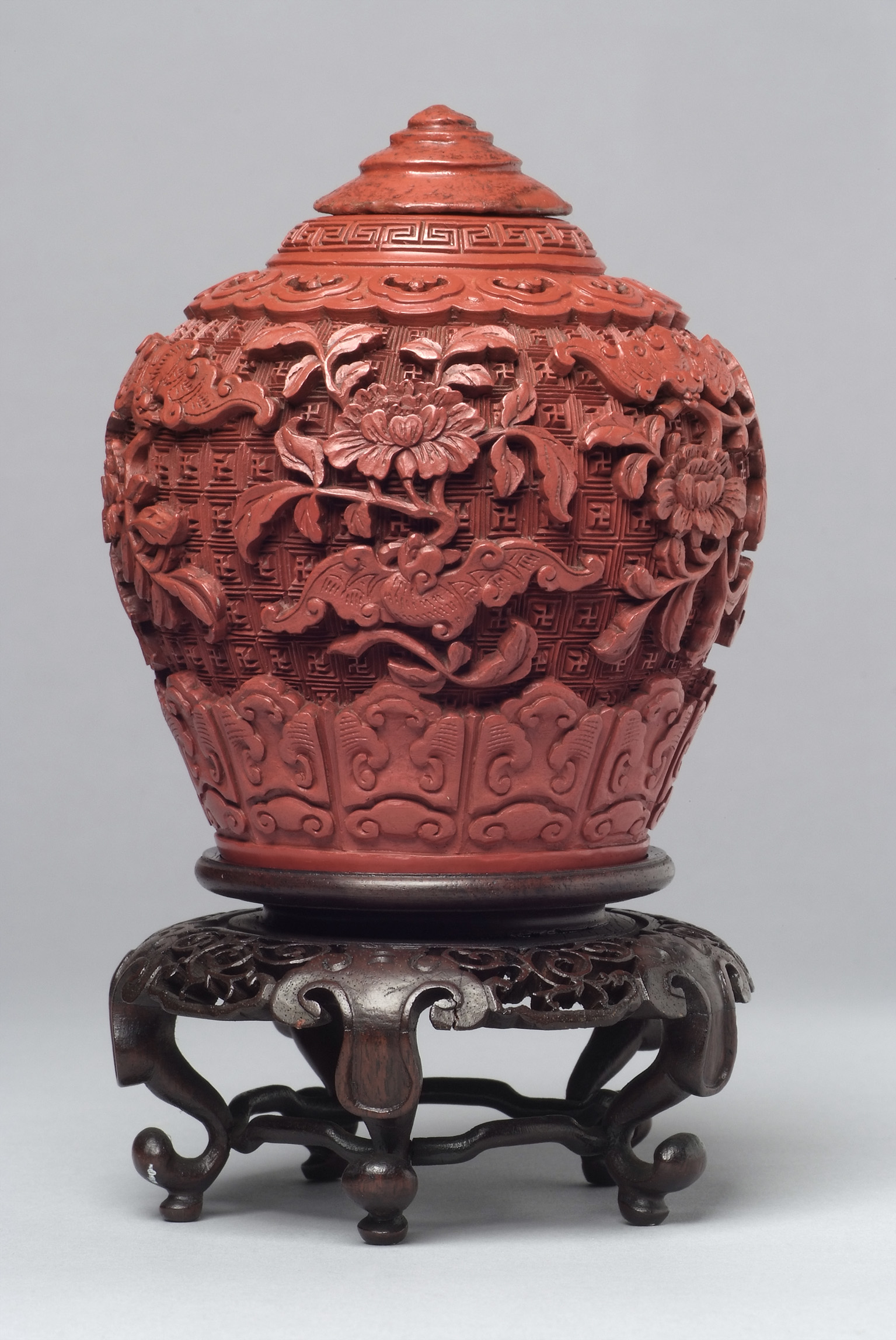 Chinese Carved Cinnabar Lacquer Jar and Cover on Stand. Qing Dynasty, 18th-19th Century. James Cromar Watt bequest, 1941. © Aberdeen City Council (Art Gallery and Museums Collections)