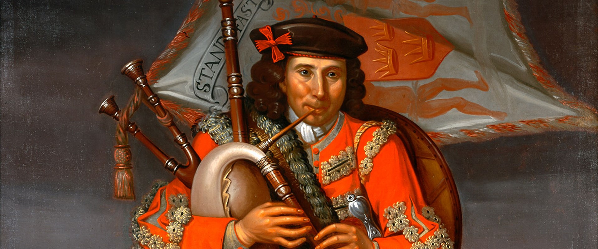 Painting of a man playing the bagpipes in the countryside. He is wearing a uniform of red tartan.