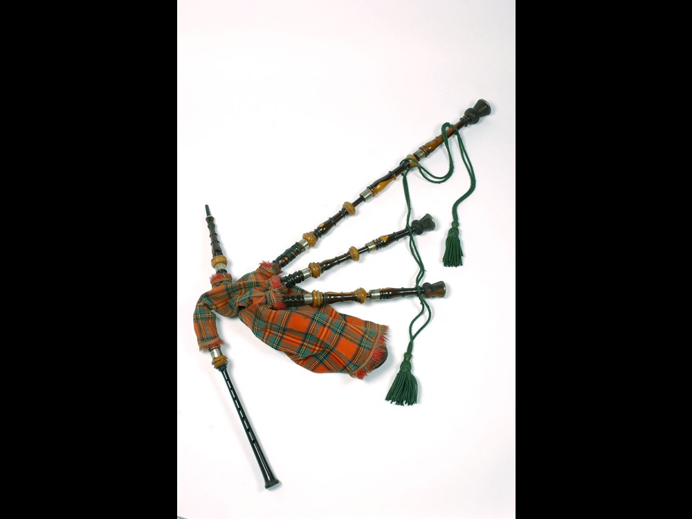 Set-of-Highland-bagpipes-of-laburnum,-silver-and-ivory-mounted,-with-Royal-Stewart-tartan-cover,-Edinburgh-c1850-1500px.jpg