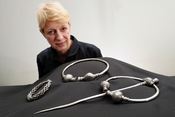 Simone Ten Hompel with silver artefacts from the 10th-century Skaill hoard. PHoto by Stewart Attwood.