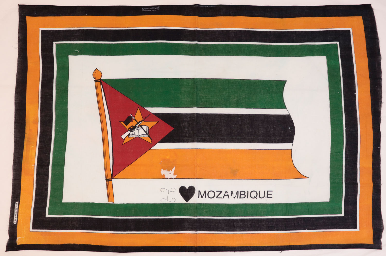 Capulana featuring the national flag of Mozambique with a border around the edge of green, black and orange with the legend 'I 'heart' Mozambique' below': Africa, Southern Africa, Mozambique, 1994-2000.