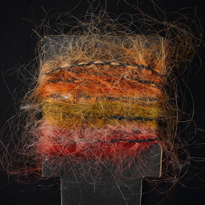 Orange, brown and green mohair sample