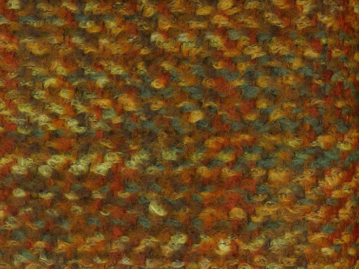 Sample of woven space-dyed mohair tweed entitled Briar, in red, green, brown and yellow.