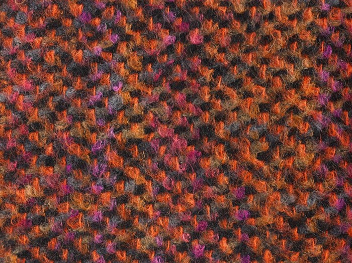 Sample of woven space-dyed mohair tweed entitled Holly, in orange, pink, purple, brown, grey and black.