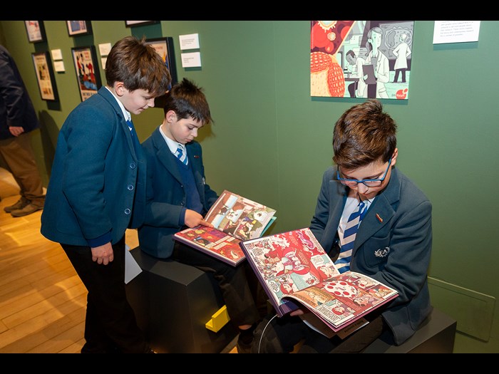 Reading comics in the Parasites exhibition © Ruth Armstrong