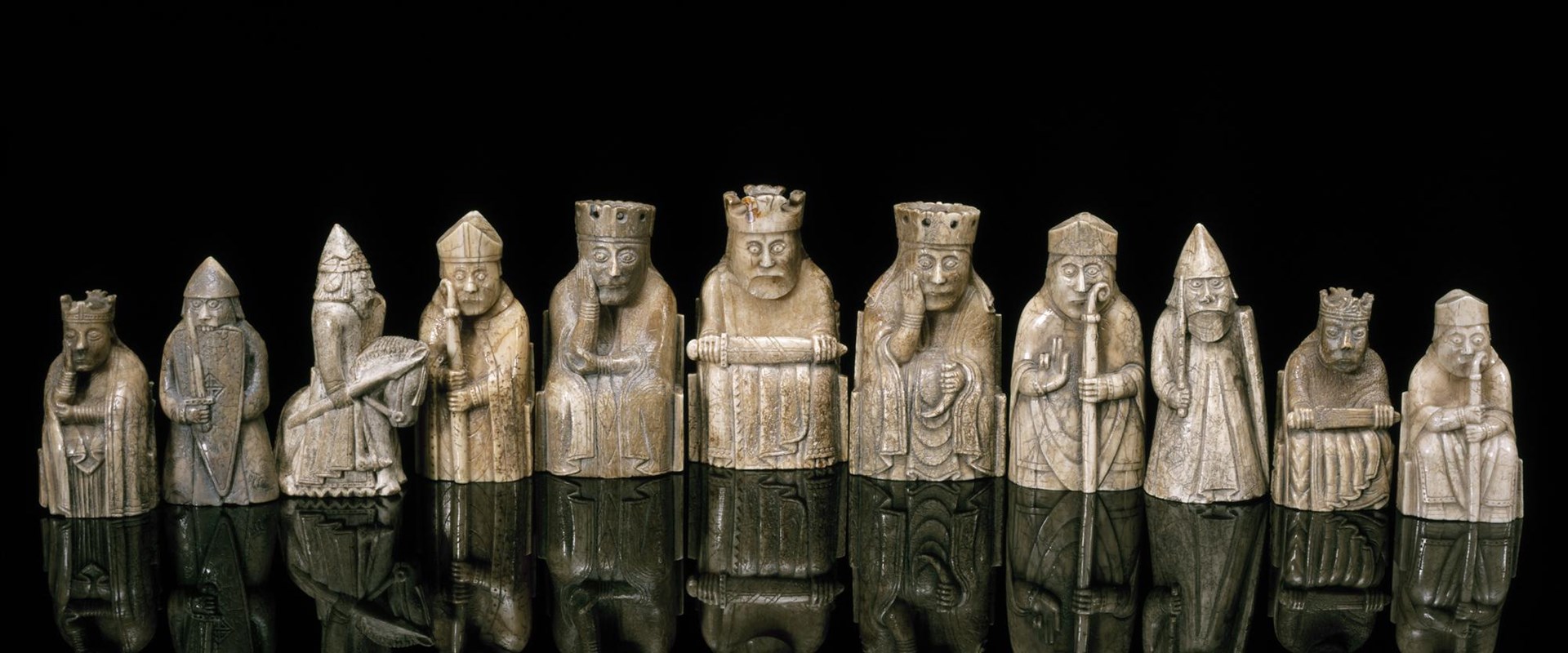 11 Lewis chess pieces - small carvings of various figures made of walrus ivory and sperm whale tooth
