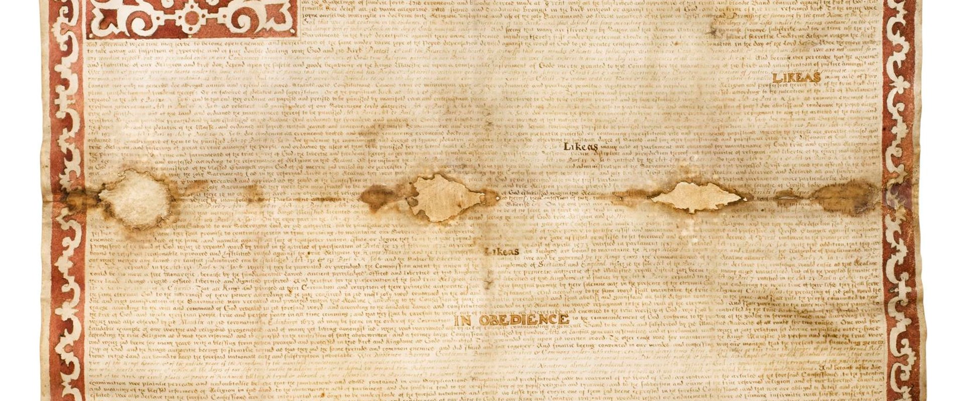 Lightly stained but wholly intact paper document with a zig-zag border and many dense lines of text.