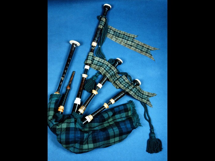 Full-sized set of Highland bagpipes with drones turned in cocus wood, 18th century. Cocus wood – a material grown in the Caribbean and inextricably bound with slavery – was often used in bagpipes because of its tonal qualities (K.1998.1130)